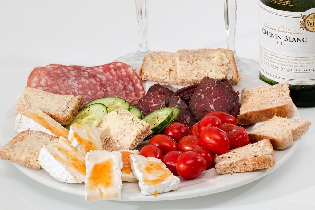 hors d'oeuvre, starters, appetizers, charcuterie, delicatessen, food platter, catering, cheese, salami, smoked beef, tomato, snack, bread, plate, cuisine, protein, antipasto, meat, tasty, platter, assortment, appetite, finger food, buffet, canapes, nourishment, nutrition, protein, protein, protein, protein, protein